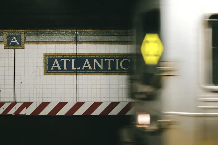 a Q train pulls into Atlantic station